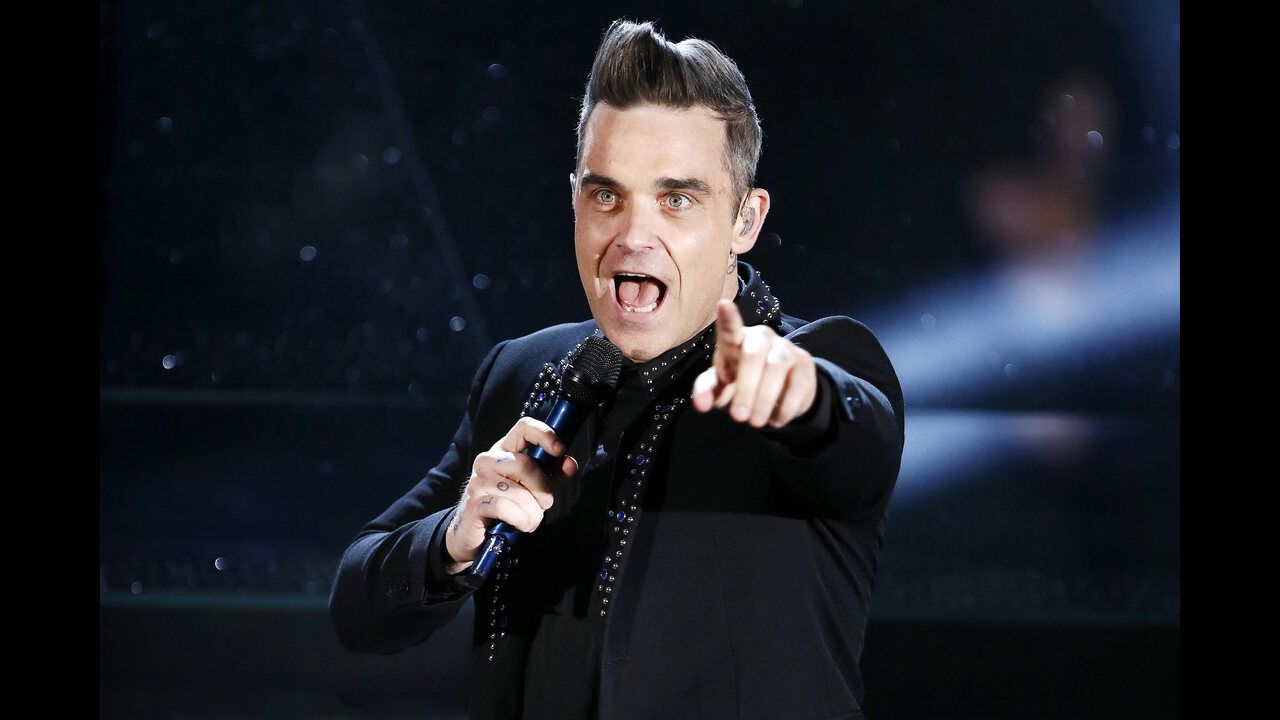 Which Football Club Does Robbie Williams Support?